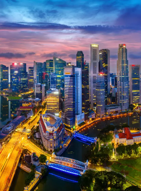 Aerial view of Singapore city at twilight.