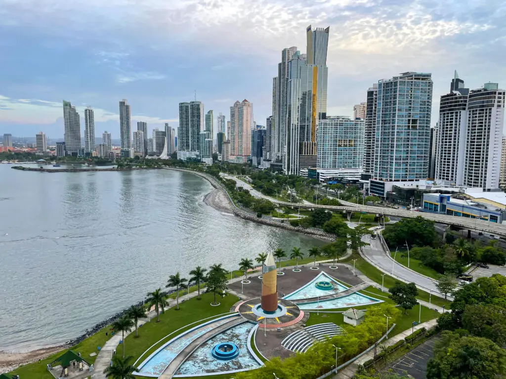 Coastal promenade and empty fountains in business district of Panama City. Business and tourist destination in Central America. Picturesque cityscape by sea with modern skyscrapers reaching into sky.