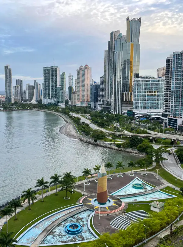 Coastal promenade and empty fountains in business district of Panama City. Business and tourist destination in Central America. Picturesque cityscape by sea with modern skyscrapers reaching into sky.