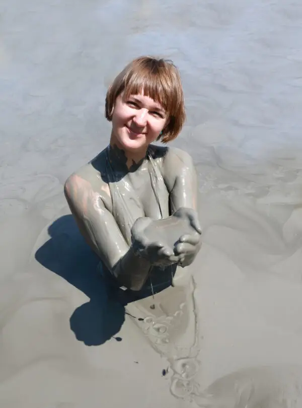 Woman in mud pond