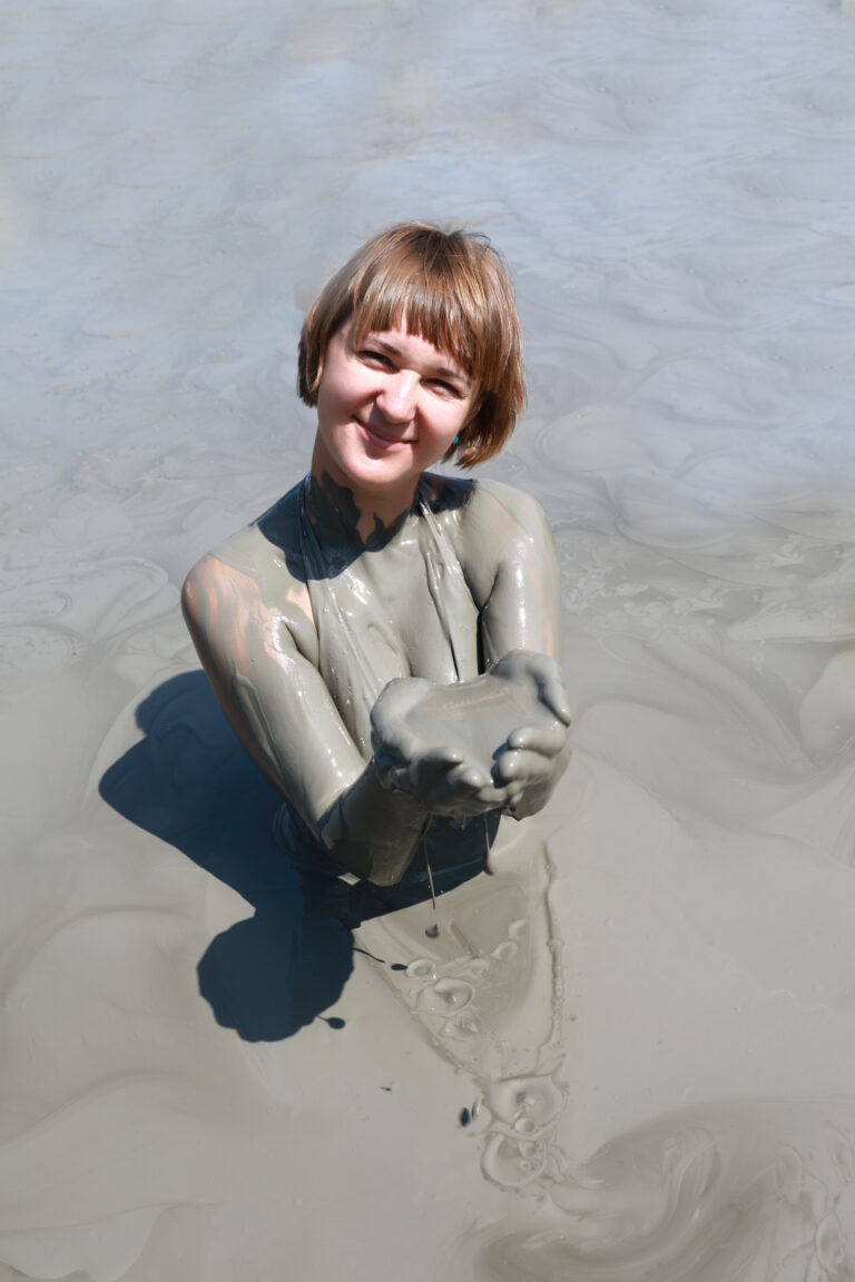 Woman in mud pond